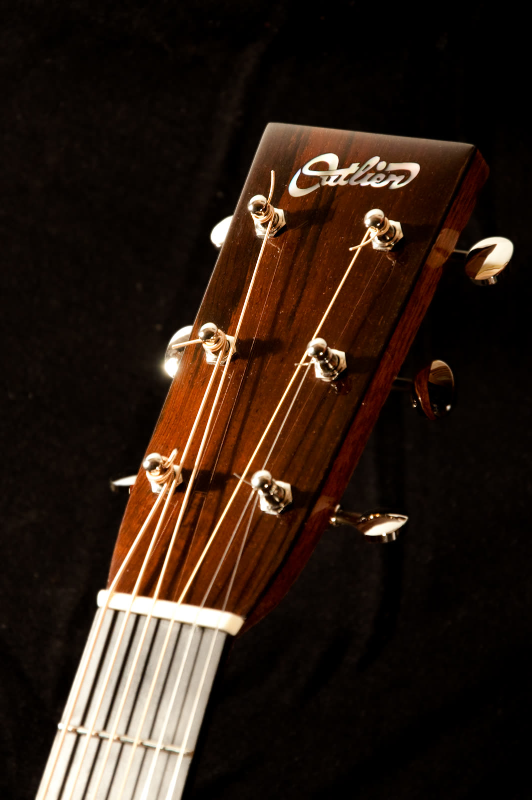 Dreadnought guitar — headstock, rosewood with pearl Outlier inlay and chrome tuning machines